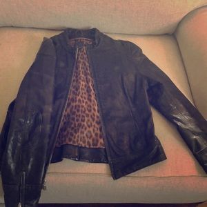 Black leather woman’s jacket size Sm.